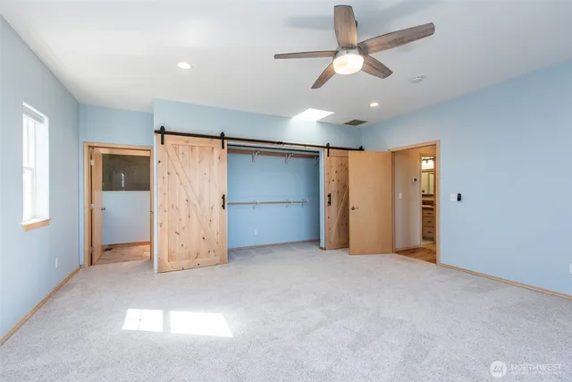 a bed room with a bed and a window