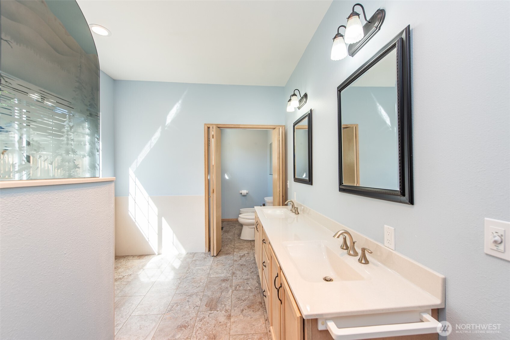 113 Quails Roost Road Sequim, WA 98382 - Photo 30 of 40 a bathroom with a sink and a mirror