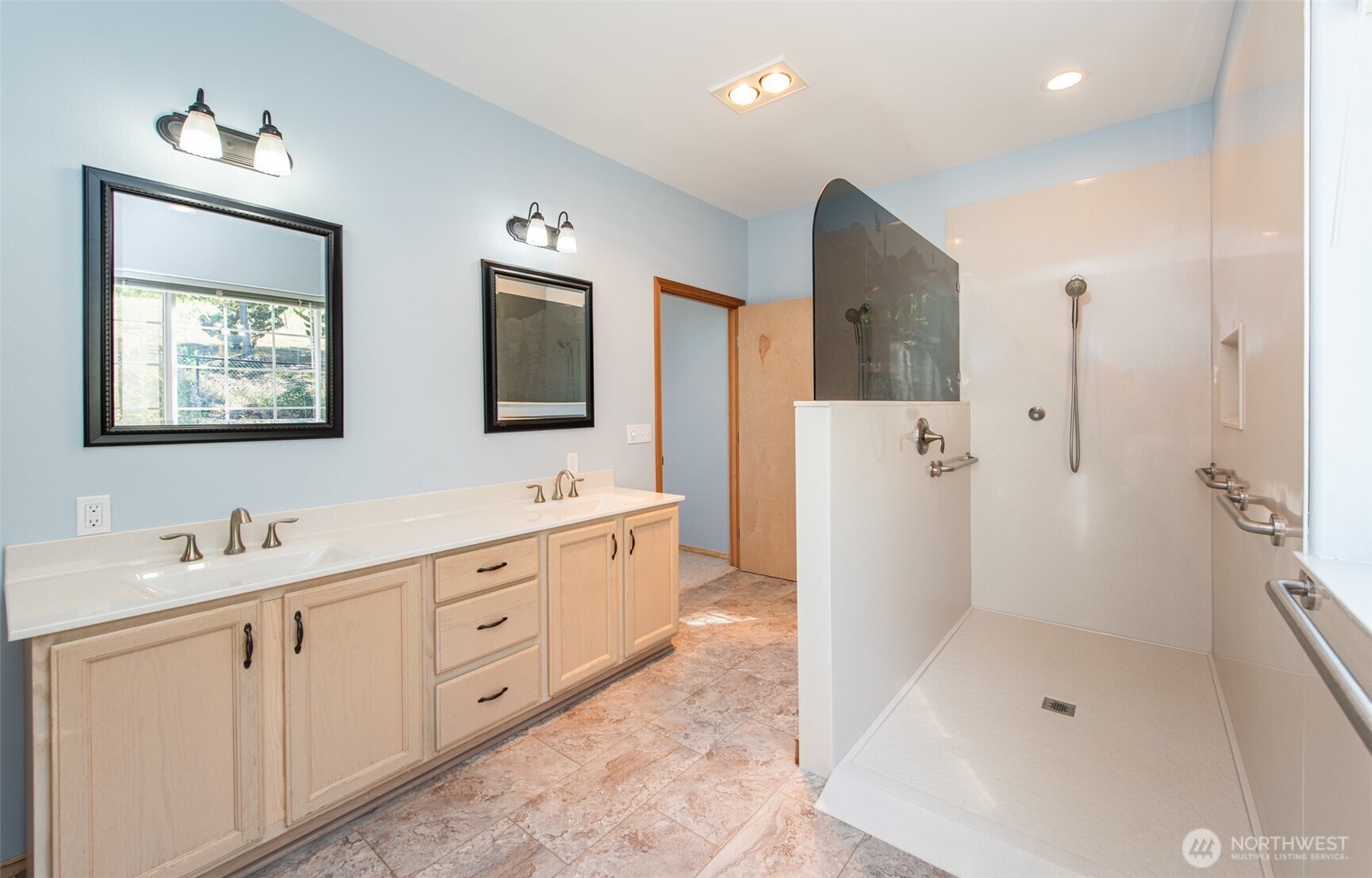 113 Quails Roost Road Sequim, WA 98382 - Photo 31 of 40 a bathroom with double vanity sink a mirror a bathtub and shower