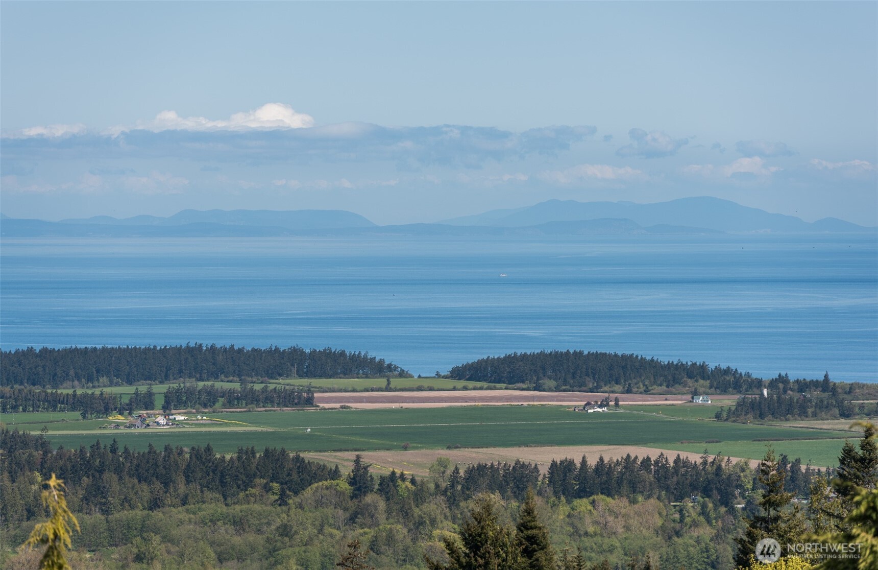 113 Quails Roost Road Sequim, WA 98382 - Photo 4 of 40 a view of a lake and a mountain