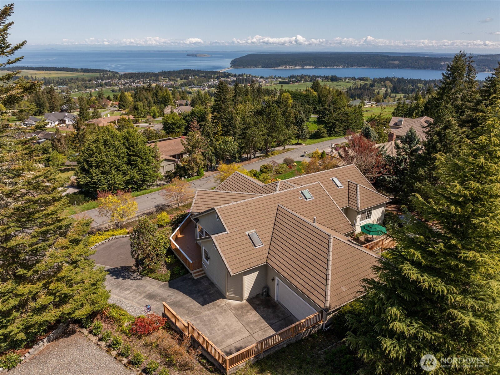 113 Quails Roost Road Sequim, WA 98382 - Photo 7 of 40 an aerial view of a house with a yard and mountain view in back