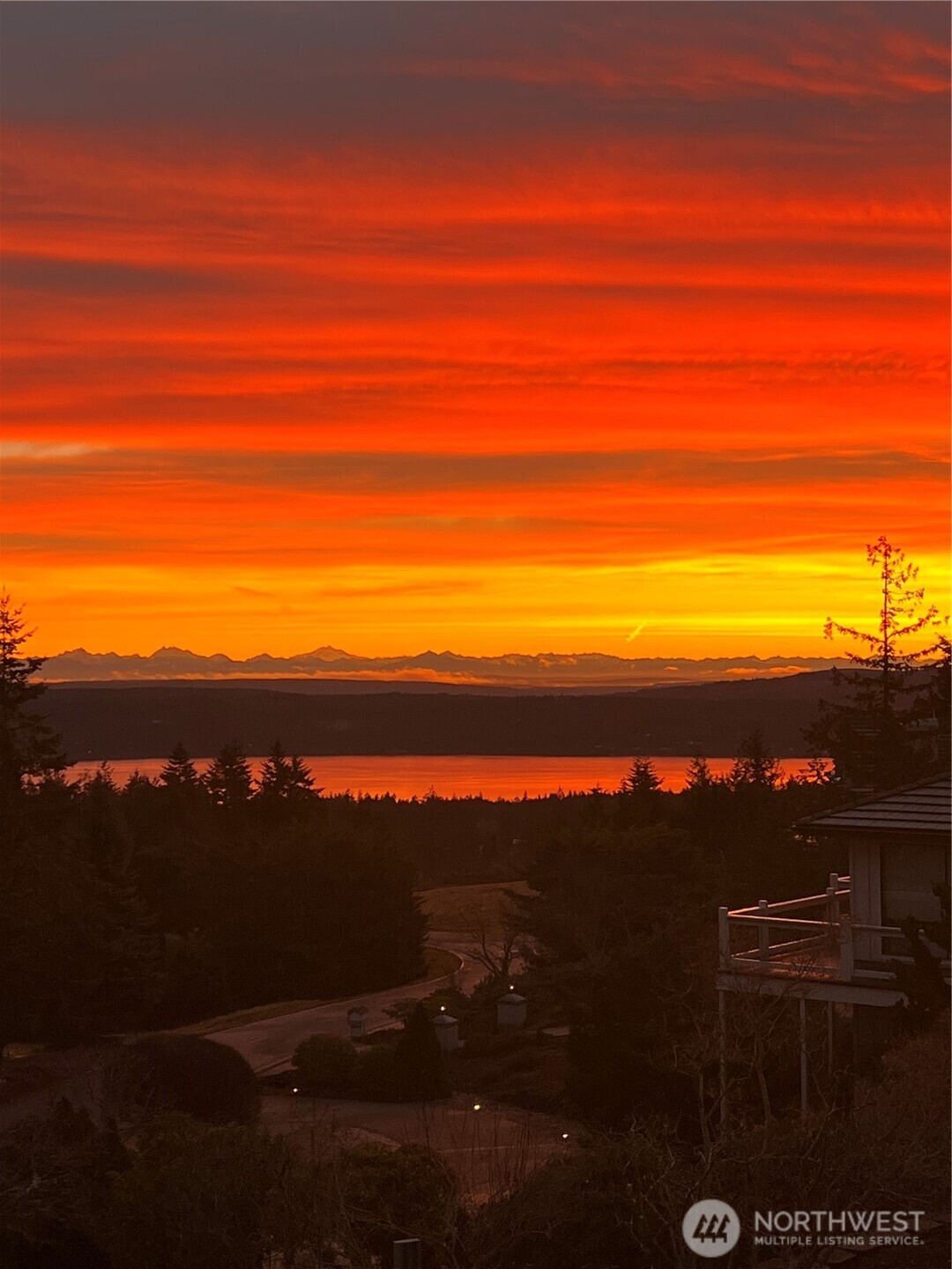 113 Quails Roost Road Sequim, WA 98382 - Photo 8 of 40 a view of a lake in middle of the sunset