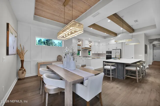 a bedroom with a large bed and a large window