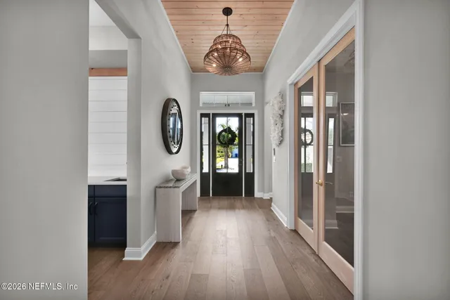 a bathroom with a toilet a sink and a mirror