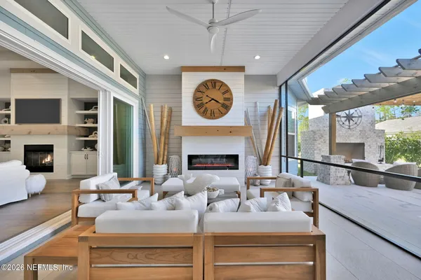 a view of an outdoor dining space with a table and chairs