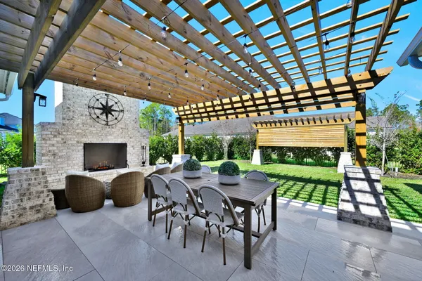 a view of a big room with a big yard and potted plants