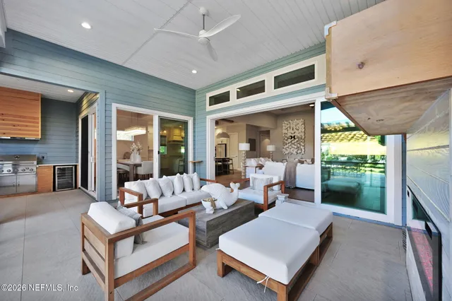 a view of backyard of a house with a patio