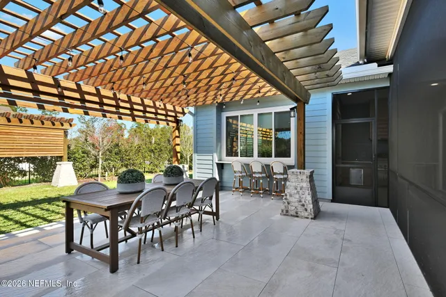 a living room with furniture gym equipment and a large window