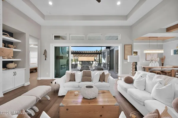 a living room with fireplace furniture and a wooden floor