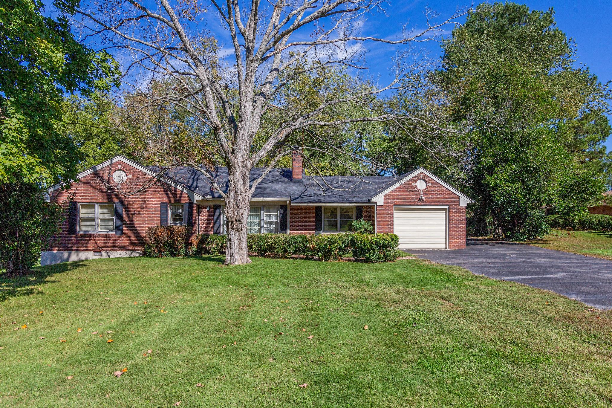 1109 Manor Road - charming brick home with a park like yard!