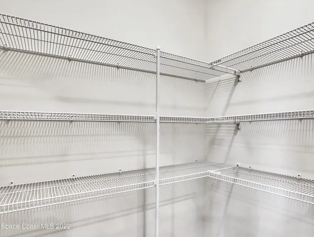 a view of a room with racks on the wall