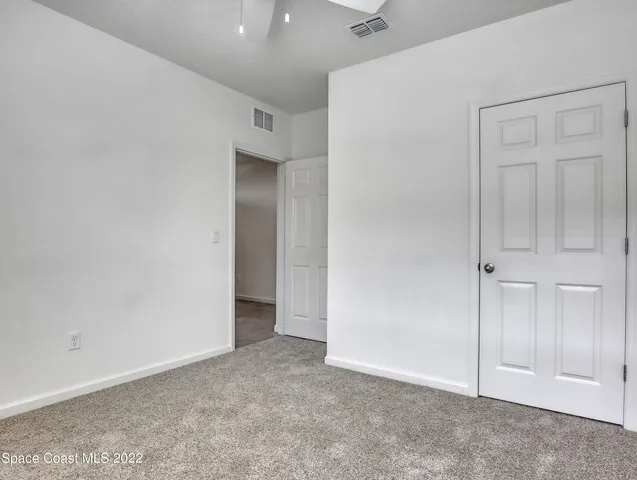 an empty room with closet area