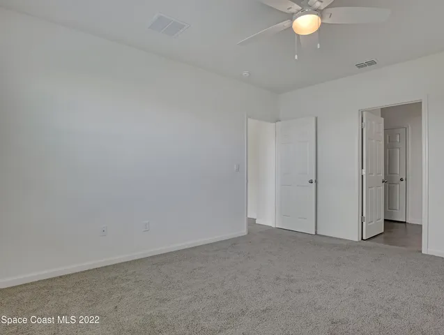 a bathroom with a shower sink and mirror
