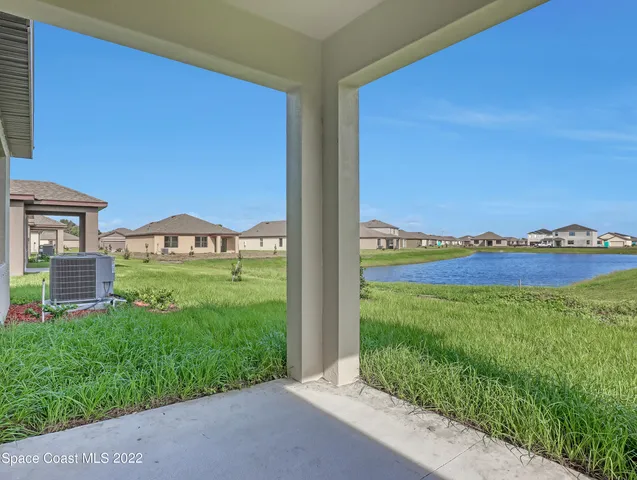 a view of an house with a backyard space