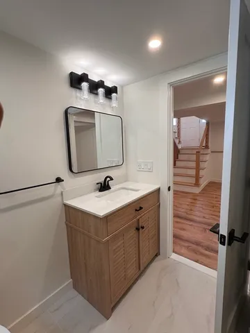 a bathroom with a sink and a mirror