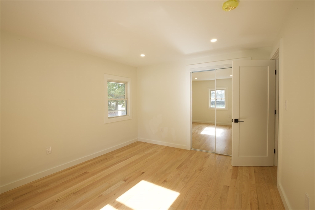 38 Middle Street Woburn, MA 01801 - Photo 26 of 39 a view of empty room with wooden floor and fan