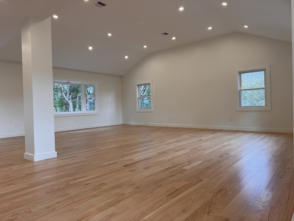 38 Middle Street Woburn, MA 01801 - Photo 30 of 39 an empty room with wooden floor and window