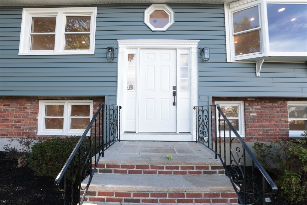 38 Middle Street Woburn, MA 01801 - Photo 35 of 39 a front view of a house with a porch