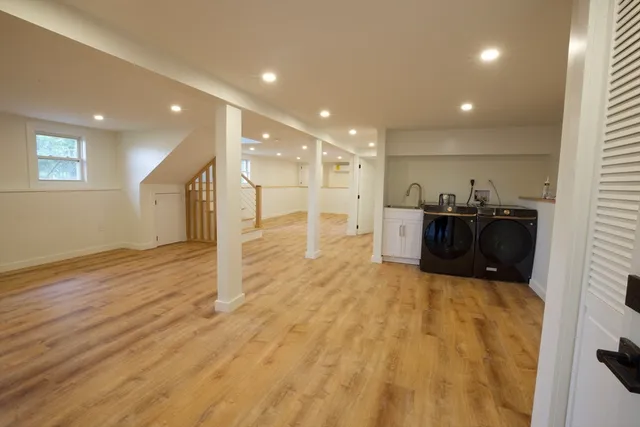 a kitchen with stainless steel appliances kitchen island granite countertop a sink and cabinets