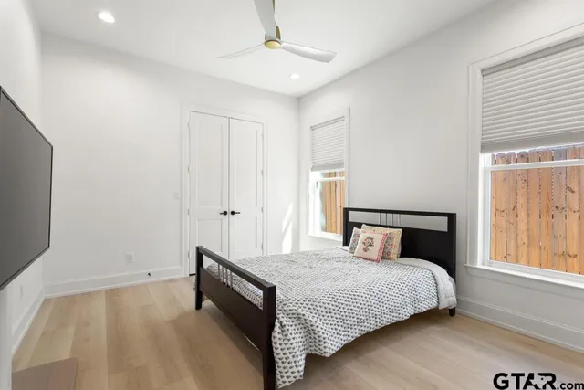 a bedroom with a bed and a window