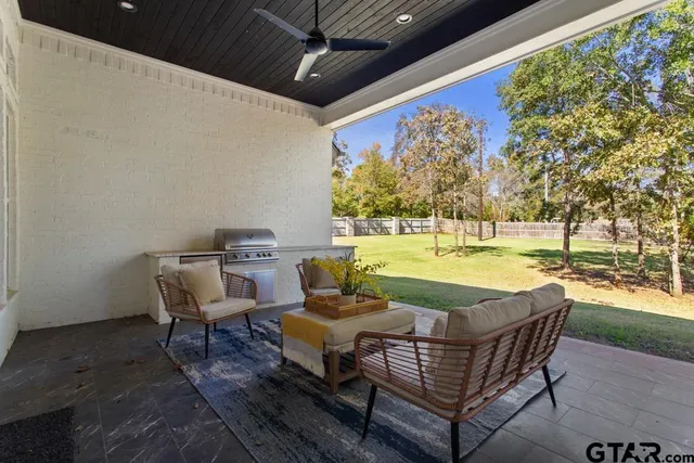 a view of swimming pool with outdoor seating and yard