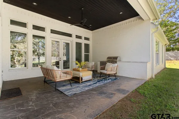 a patio with patio couch and table