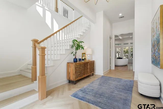 a living room with furniture and a rug