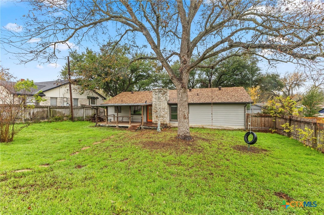413 Suzzane Road Pflugerville, TX 78660 - Photo 18 of 23 Back of property featuring a fenced backyard and a covered porch/patio area