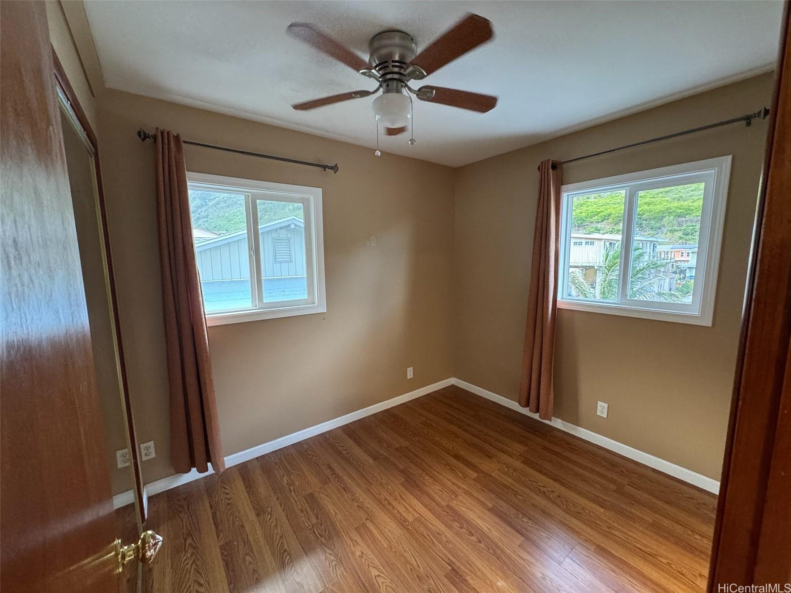541 Kuliouou Road Honolulu, HI 96821 - Photo 13 of 21 a view of room with window and hardwood floor