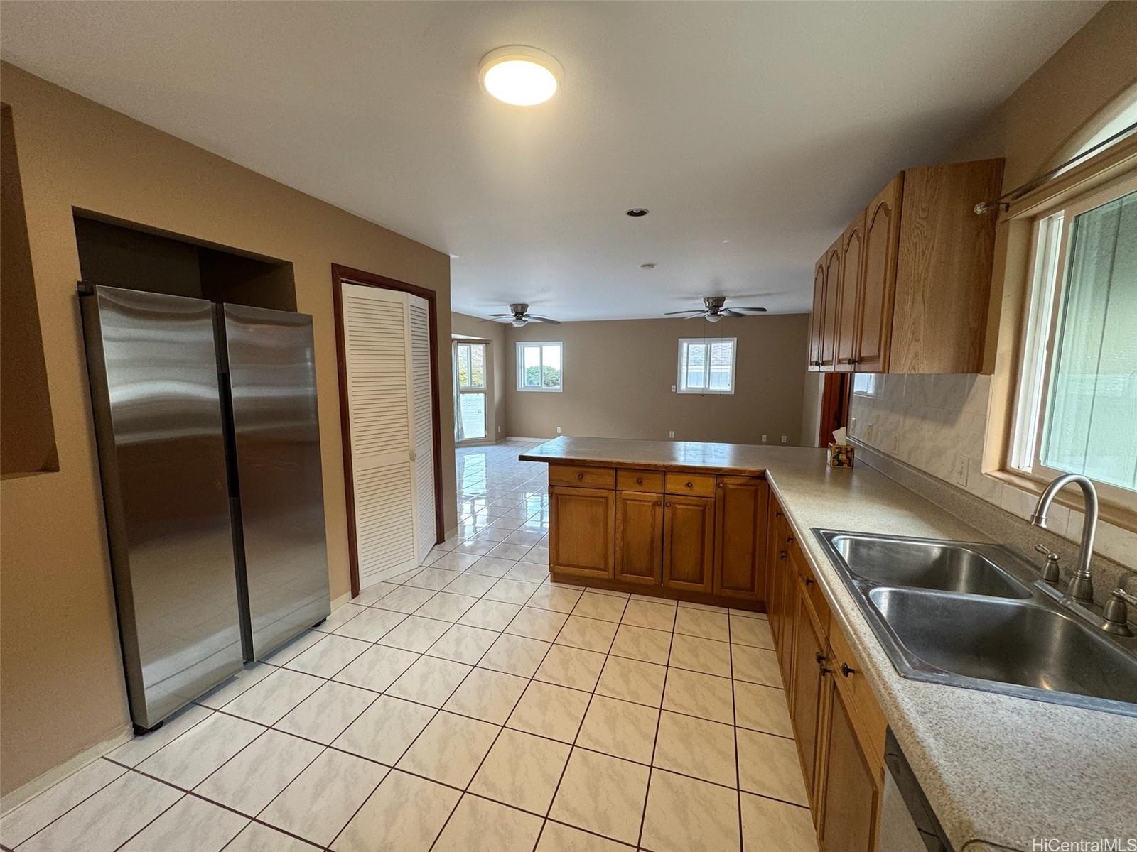 541 Kuliouou Road Honolulu, HI 96821 - Photo 15 of 21 a kitchen with granite countertop a refrigerator and a sink