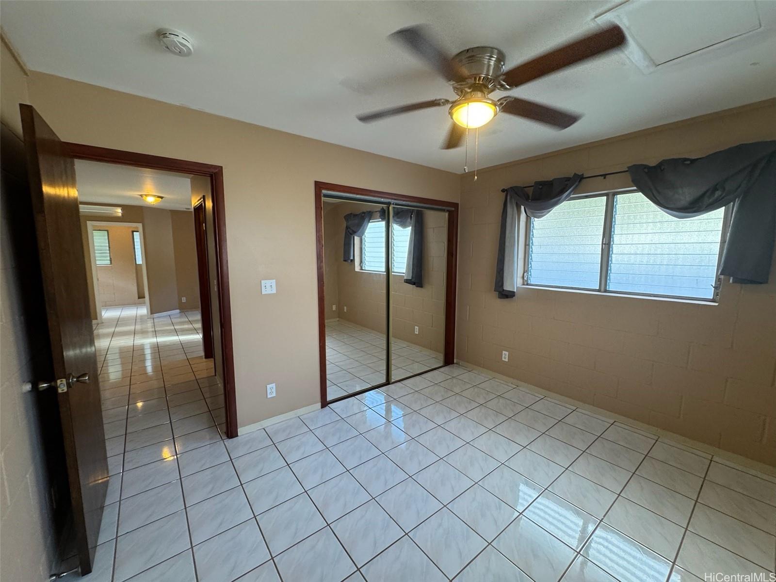 541 Kuliouou Road Honolulu, HI 96821 - Photo 20 of 21 an empty room with closet and a chandelier fan