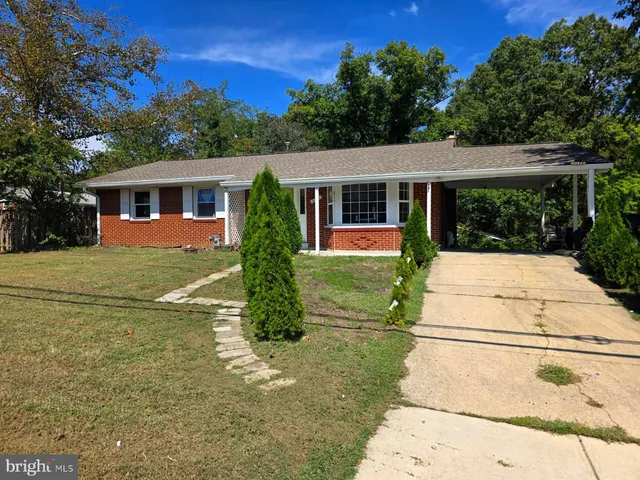 a view of house with yard