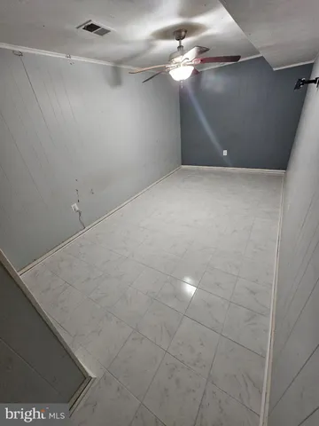 a view of a ceiling fan in a room