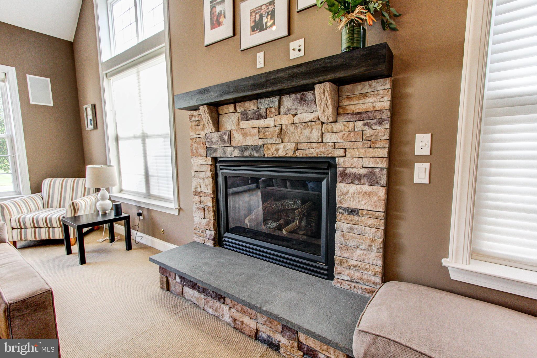 2196 Glenridge Road Furlong, PA 18925 - Photo 16 of 42 Stacked Stone Fireplace with Raised Slate Hearth