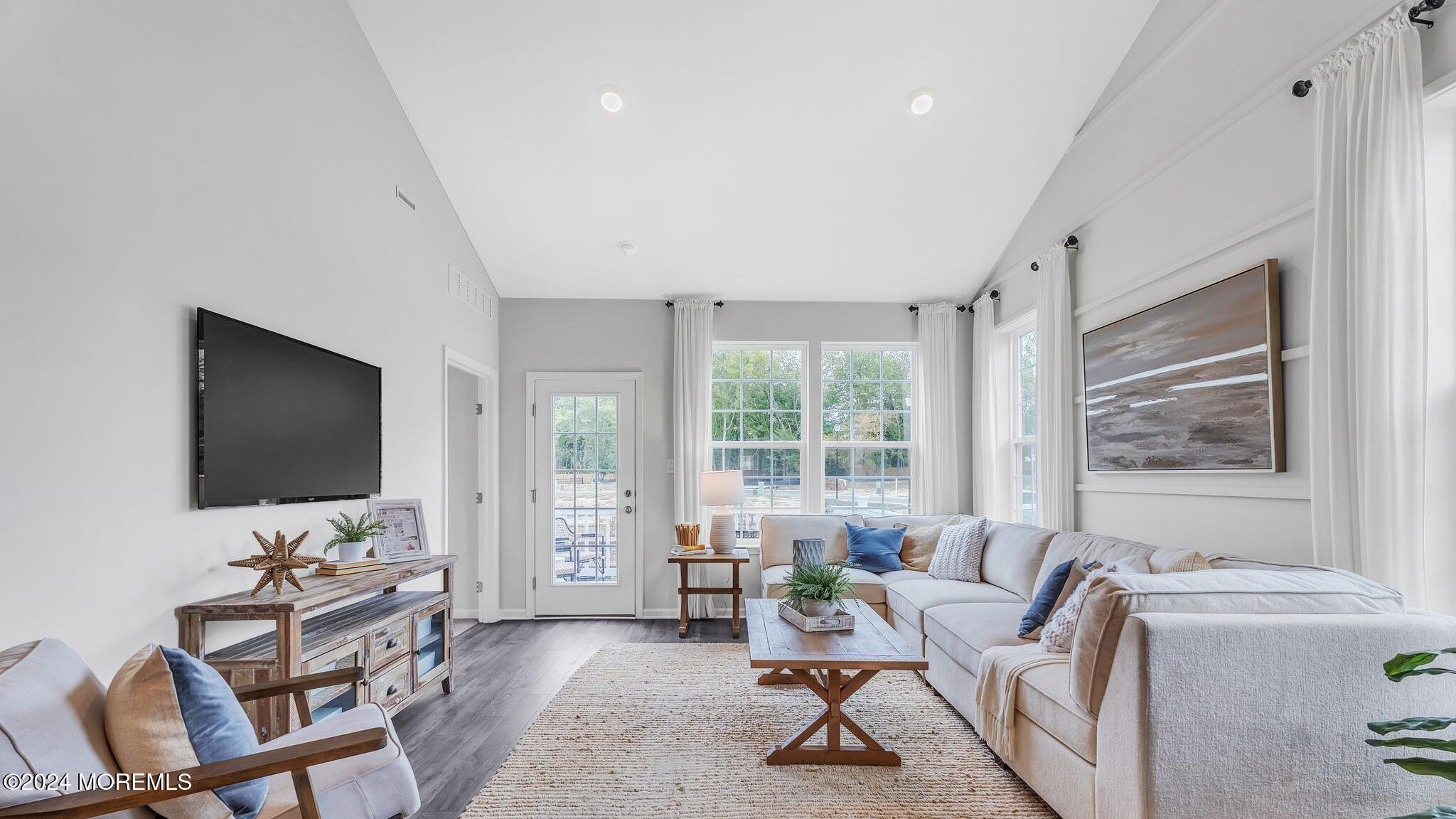 67 Penny Lane Neptune Township, NJ 07753 - Photo 13 of 29 a living room with furniture and a flat screen tv