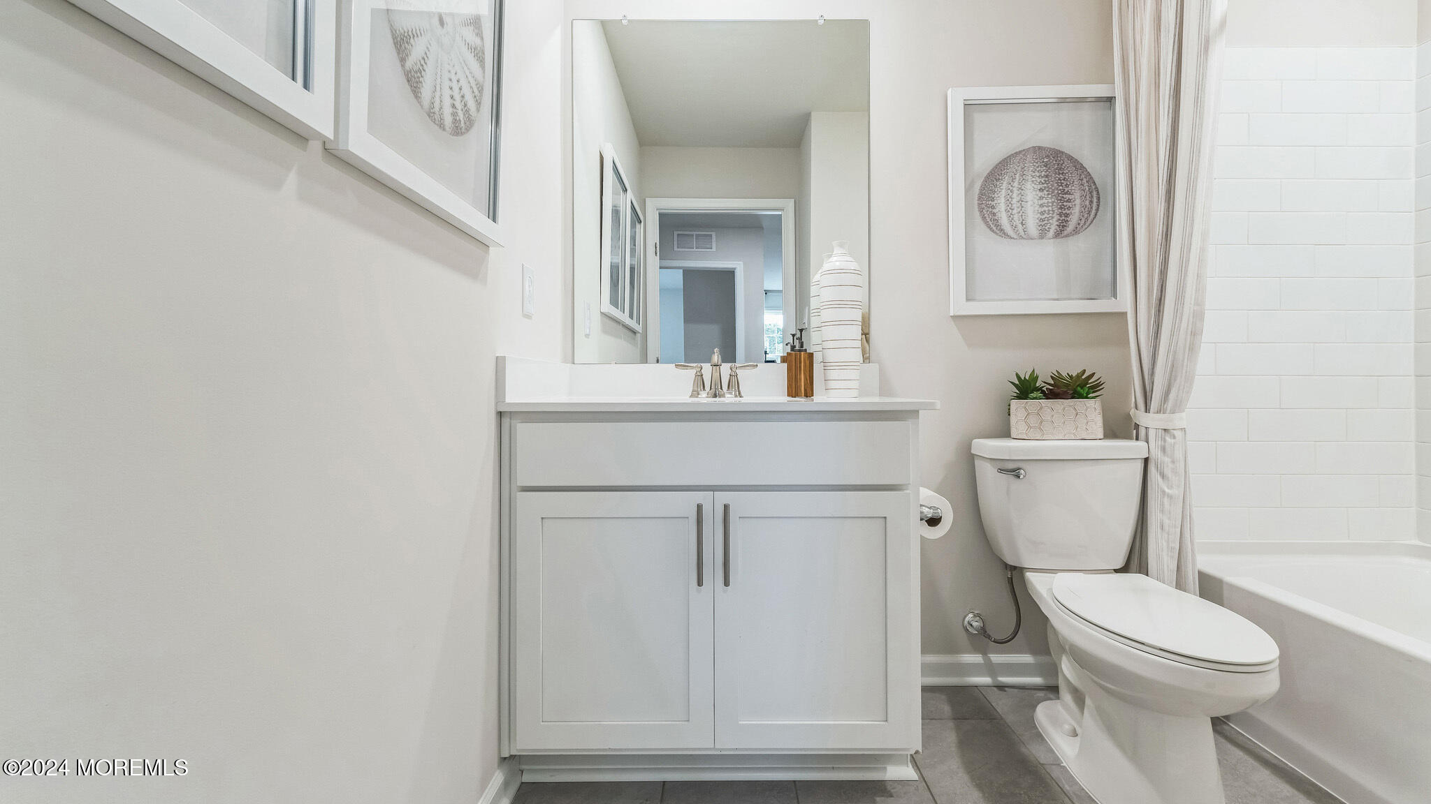 67 Penny Lane Neptune Township, NJ 07753 - Photo 28 of 29 a bathroom with a toilet a sink and mirror
