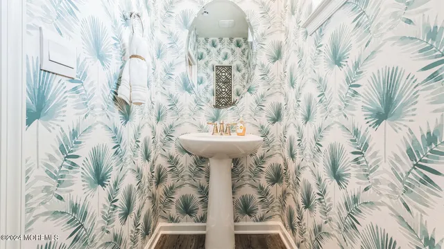 a bathroom with a sink and mirror