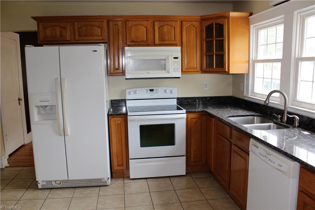 5517 Old Thomasville Road High Point, NC 27263 - Photo 8 of 30 UPDATED KITCHEN WITH GRANITE TOPS! ALL APPLIANCES STAY INCLUDING WASHER AND DRYER