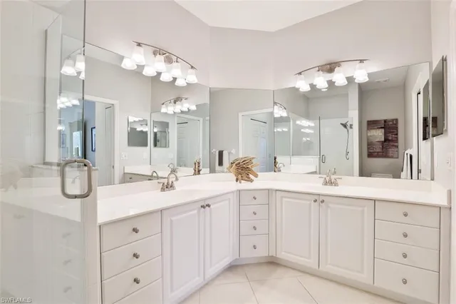a bathroom with a sink vanity and a mirror