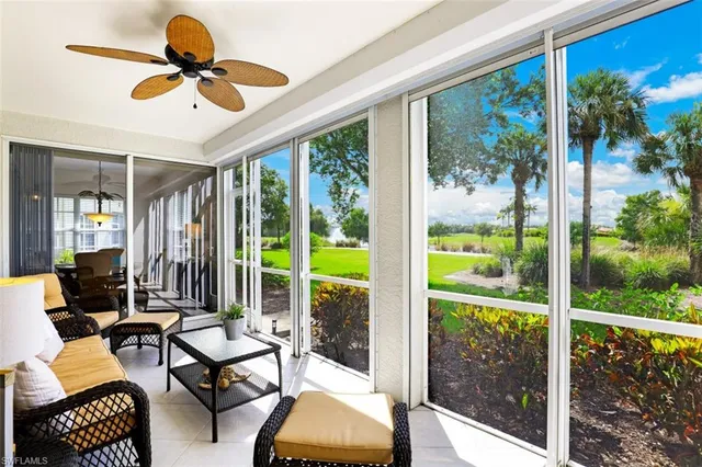 a living room with furniture and garden view