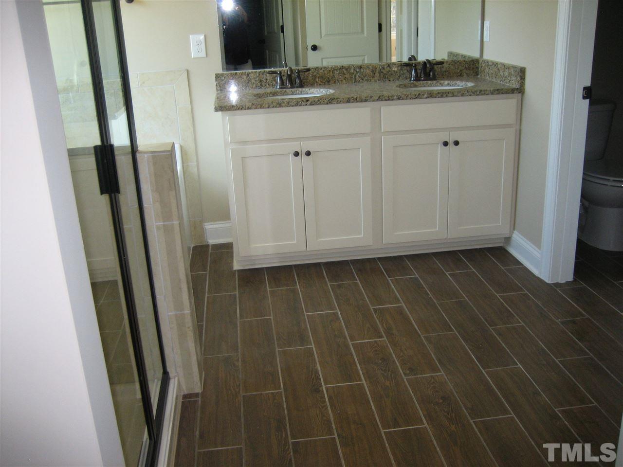 3618 Greenville Loop Road Wake Forest, NC 27587 - Photo 14 of 25 Another view of Master Bath - Beautiful - Wrought Iron finishes throughout the home