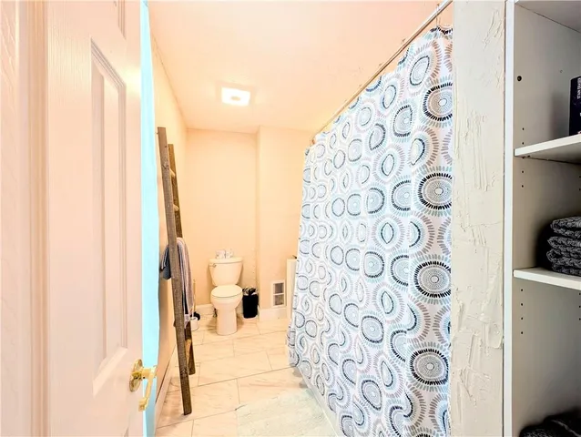 a view of a two chairs in the balcony