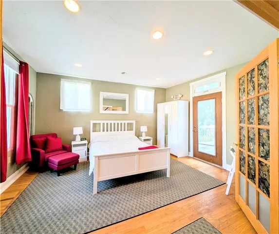 a bedroom with a bed and a couch