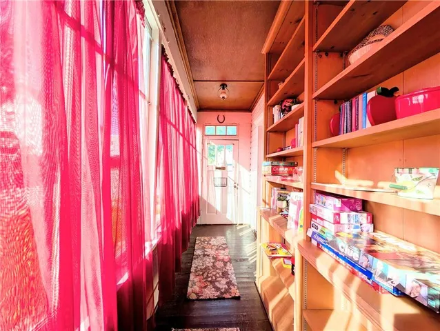 a kitchen with a table chairs stove and cabinets