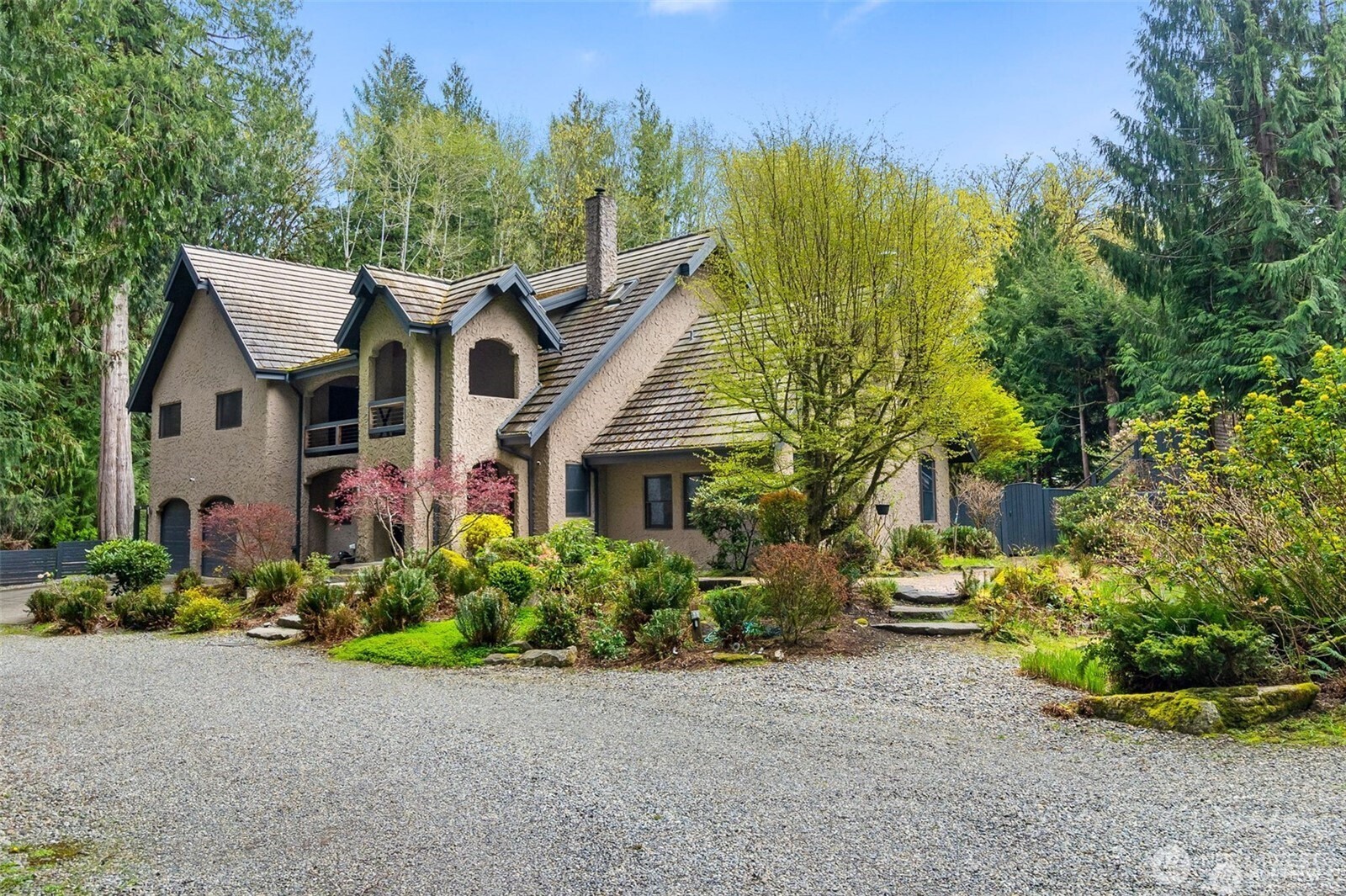 3723 36th Loop Northwest Olympia, WA 98502 - Photo 1 of 1 a front view of a house with a garden