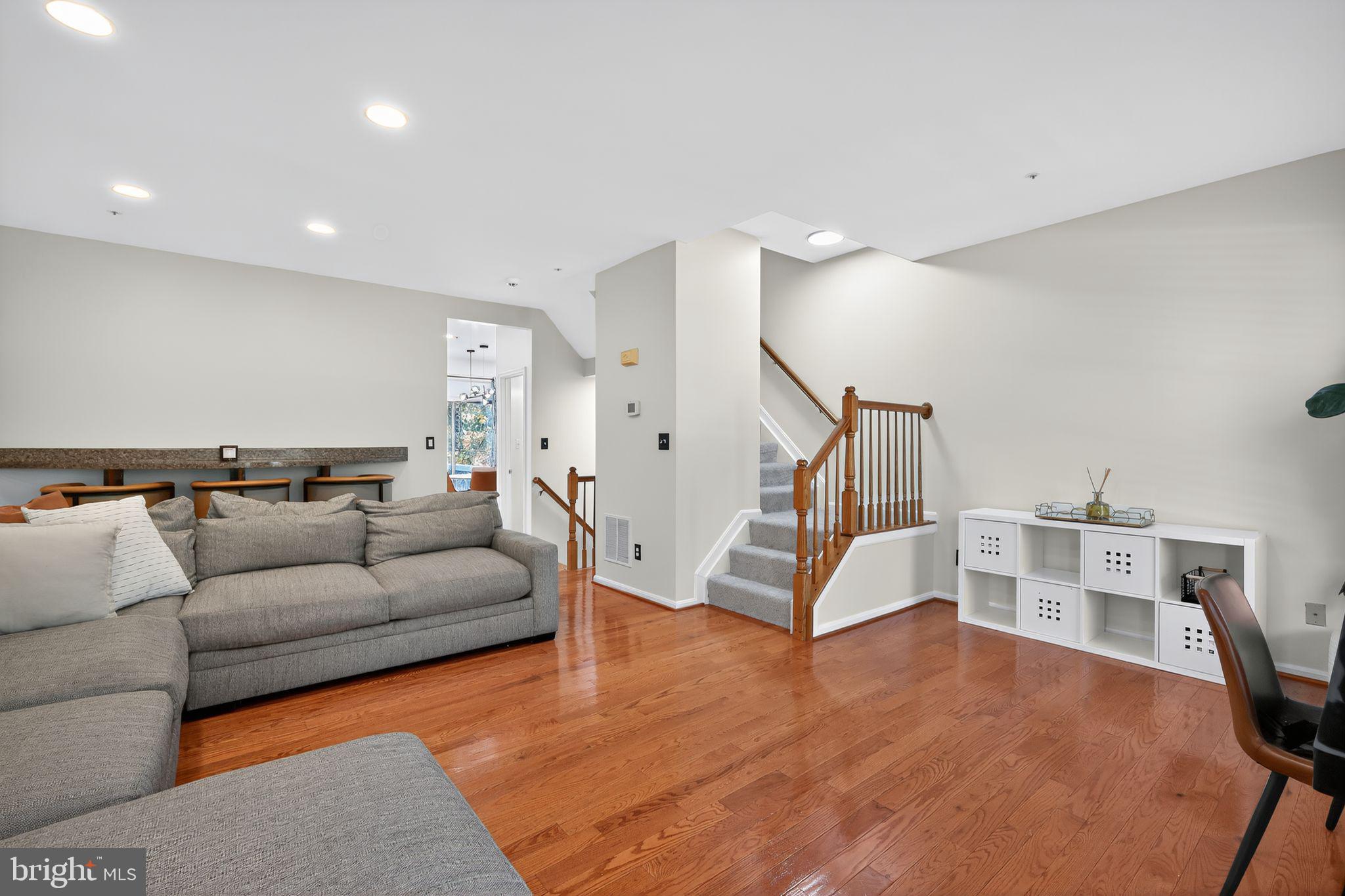 1707 Severn Tree Court Severn, MD 21144 - Photo 11 of 37 a living room with furniture and wooden floor