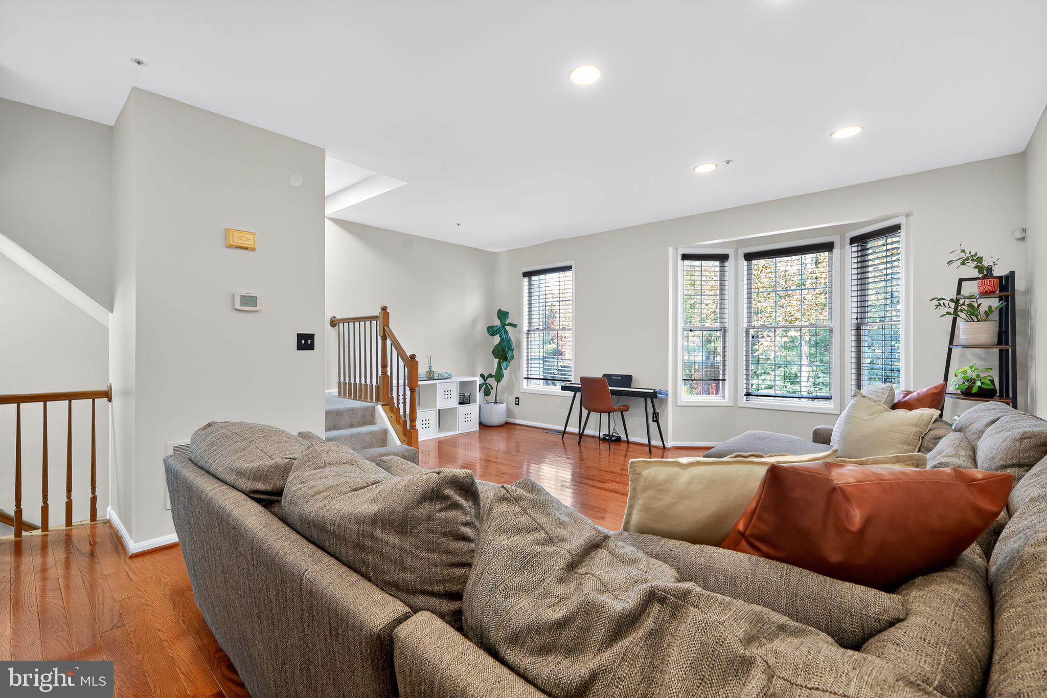 1707 Severn Tree Court Severn, MD 21144 - Photo 12 of 37 a living room with furniture and a large window
