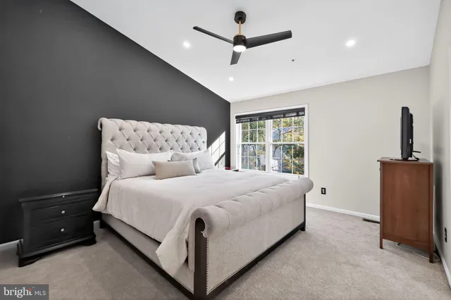 a bed room with a bed and a window