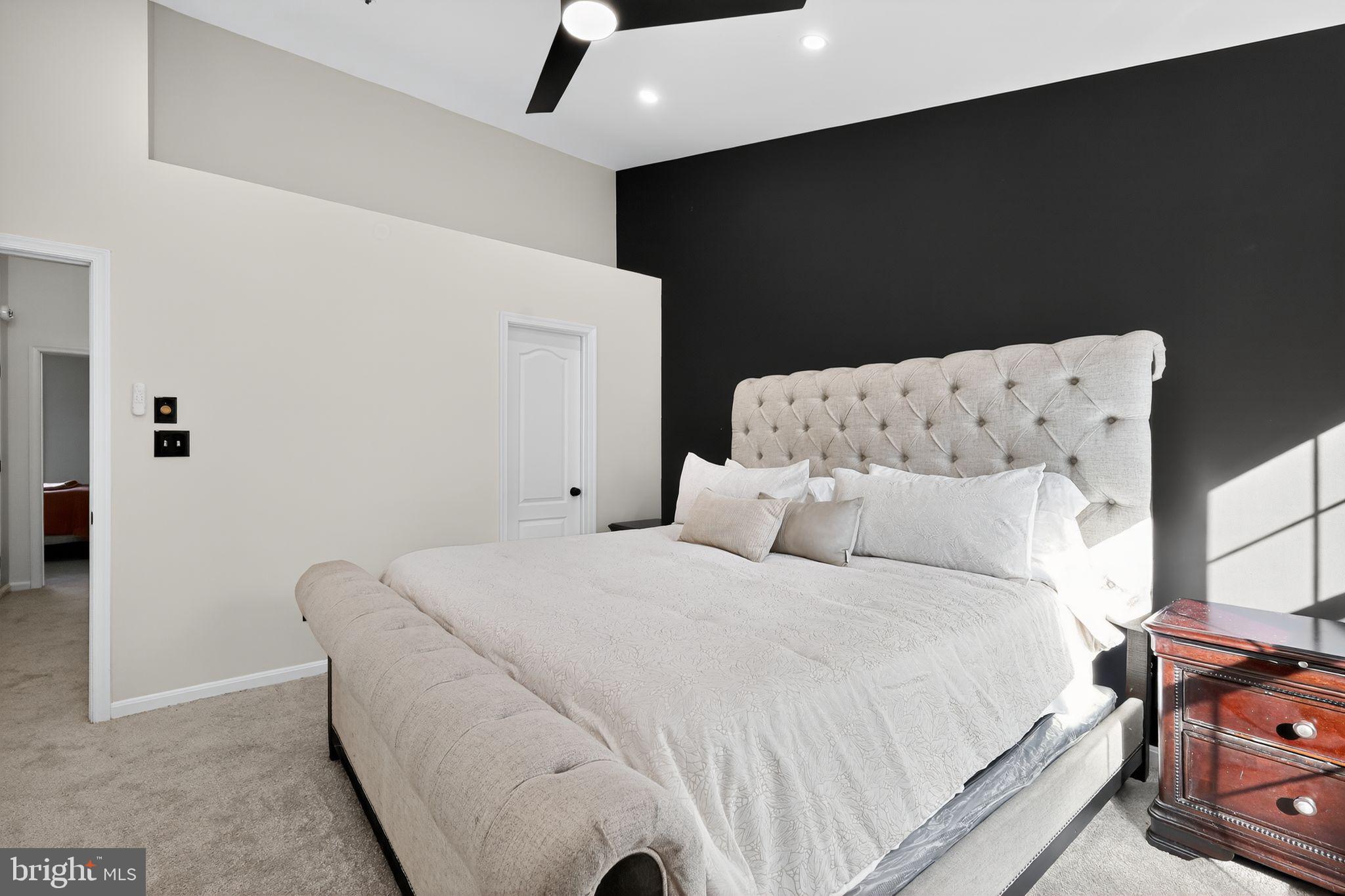 1707 Severn Tree Court Severn, MD 21144 - Photo 20 of 37 a large white bed in a small room