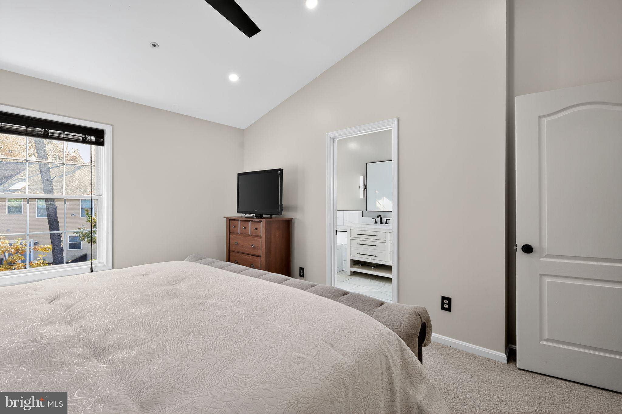 1707 Severn Tree Court Severn, MD 21144 - Photo 21 of 37 a bedroom with a bed and a flat tv screen
